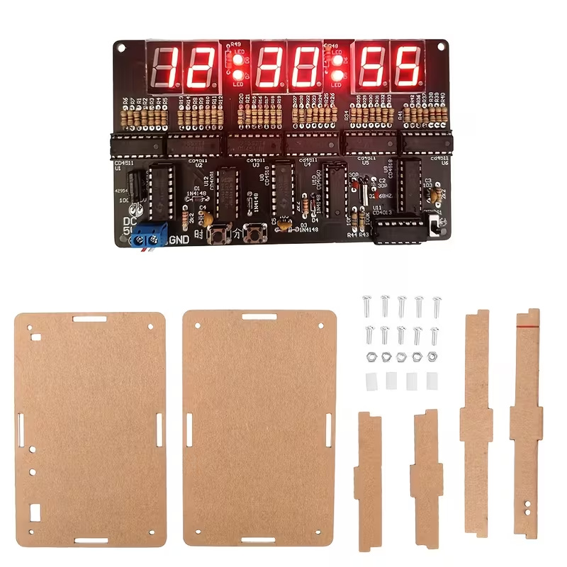 Supplier photo of a six-digit clock circuit board, separate case panels with protective film, screws and spacers.