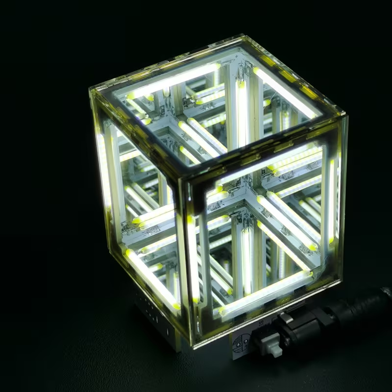 Supplier photo of an assembled infinity mirror light cube illuminated on a dark background.